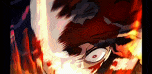 a close up of a person 's face with flames coming out of it 's eyes .