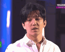 a man in a white shirt is on a television screen with a purple border that says центральный телеканал