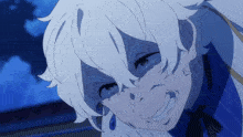 a close up of a person 's face with white hair and a blue background