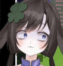 a close up of a girl with a clover in her hair making a face .