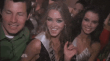 a woman wearing a sash that says new york