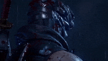 a close up of a ninja with blood on his face holding a sword