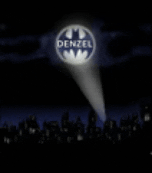 a batman logo that says denzel is projected in the night sky