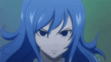a close up of a girl 's face with blue hair and black eyes