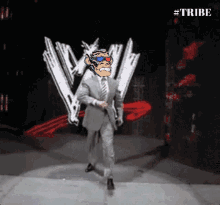 a man in a suit and tie is walking in front of a sign that says tribe