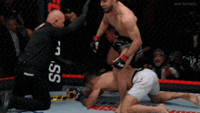 a man in a cage with a sign that says ufc fightpass