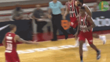 a basketball player in a red jersey with the number 10 on it