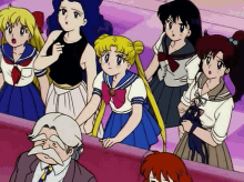 a group of anime characters including sailor moon are standing around a man with a beard