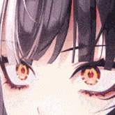 a close up of a girl 's eyes with a candle in them