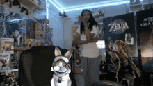 a man and a dog are standing in front of a zelda sign