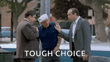 a group of men are standing next to each other and talking in a park .