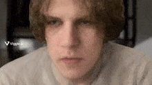 a close up of a man 's face with a viggle.ai watermark