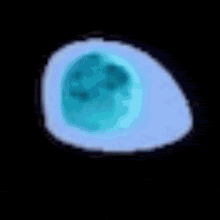 a pixel art drawing of a green glowing object on a black background