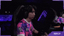 a man wearing headphones and a shirt that says pulsar