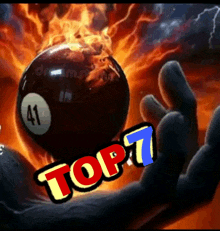 a pool ball with the number 41 on it is being held by a hand