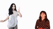 a woman is dancing in front of a sign that says ' hadir untuk supportnya very '