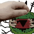 a hand is reaching out towards a cartoon monster with a bloody face .
