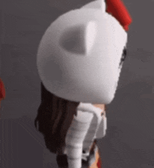 a close up of a cartoon character wearing a white cat hat and a red bow .