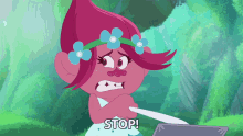 a troll with flowers in her hair is holding a knife and saying stop