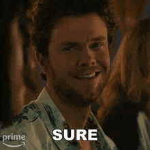 a man with a beard says sure in front of an amazon logo