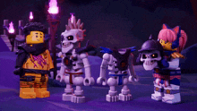 a group of skeletons are standing next to each other