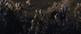 a giant monster is standing on top of a pile of rocks in a video game .