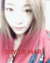 a woman with pink hair and the words soy de mar on the bottom right
