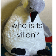 a stuffed penguin with the words " who is ts villan " written on it