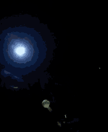 a full moon is shining brightly in the dark