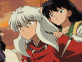 a couple of anime characters one of which has a necklace on