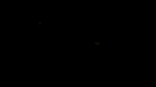 an aerial view of a white car with neon arrows behind it