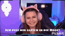 a girl wearing headphones with cat ears says ich piss mir gleich in die hose picsart