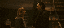 a man and a woman are looking into each others eyes