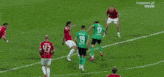 a blurry picture of a soccer game with a tvpsport.pl banner in the background