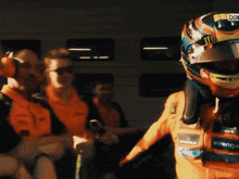 a man wearing a helmet that says ' bose ' on it