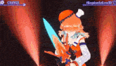 a girl in a hat is holding a sword on a stage in front of a crowd .