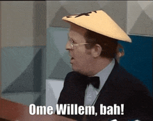 a man wearing glasses and a hat says ome willem bah !
