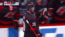 a hockey player wearing a number 20 jersey