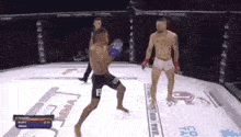 two men are fighting in a boxing ring and one has the letter f on his shorts .