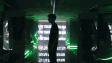 a man is standing in front of a screen that says ' a '