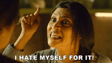 a woman says i hate myself for it while pointing up