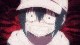 a close up of a person 's face with a hat
