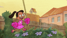a girl in a cheerleader outfit with the letter t on it