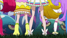 a group of three anime girls standing in the grass