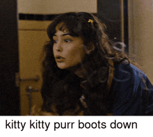 a picture of a woman with the words kitty kitty purr boots down below her