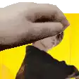 a close up of a hand holding a person 's head .