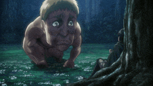 a man is kneeling down next to a tree while another man sits in the grass