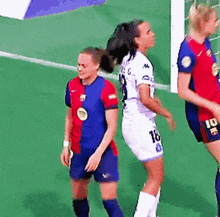 a female soccer player wearing a number 18 jersey