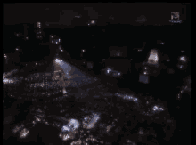 an aerial view of a crowd of people at a concert with the words voiceoff visible