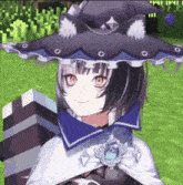 a girl in a witch costume is holding a gift box